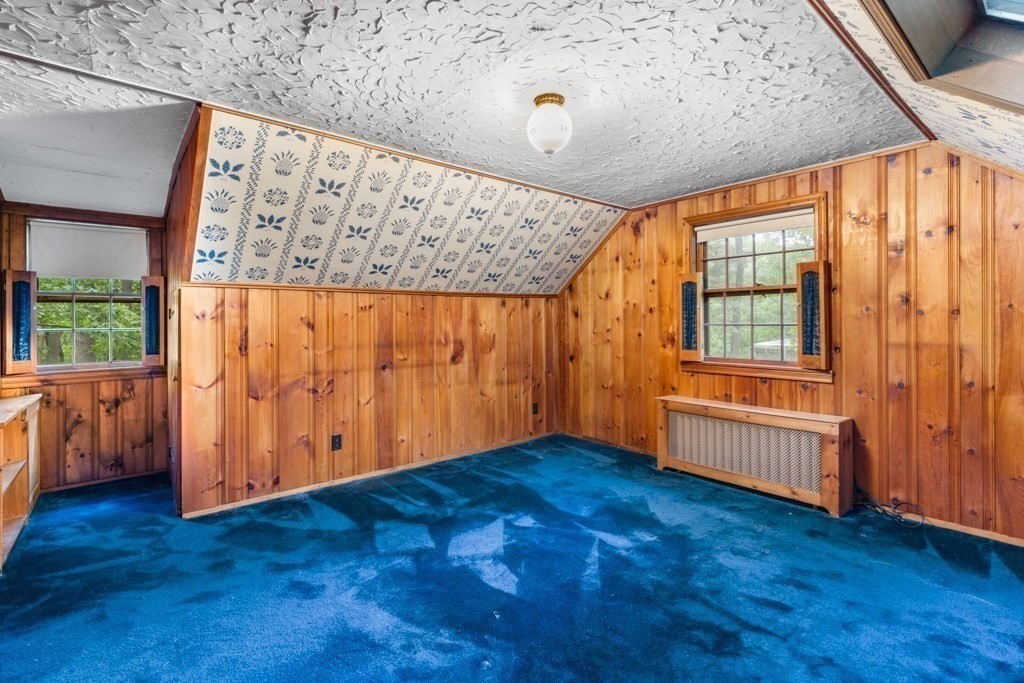 19 Forest Road Wakefield, MA 01880 - Photo 22 of 30 a view of an empty room with wooden floor and stairs