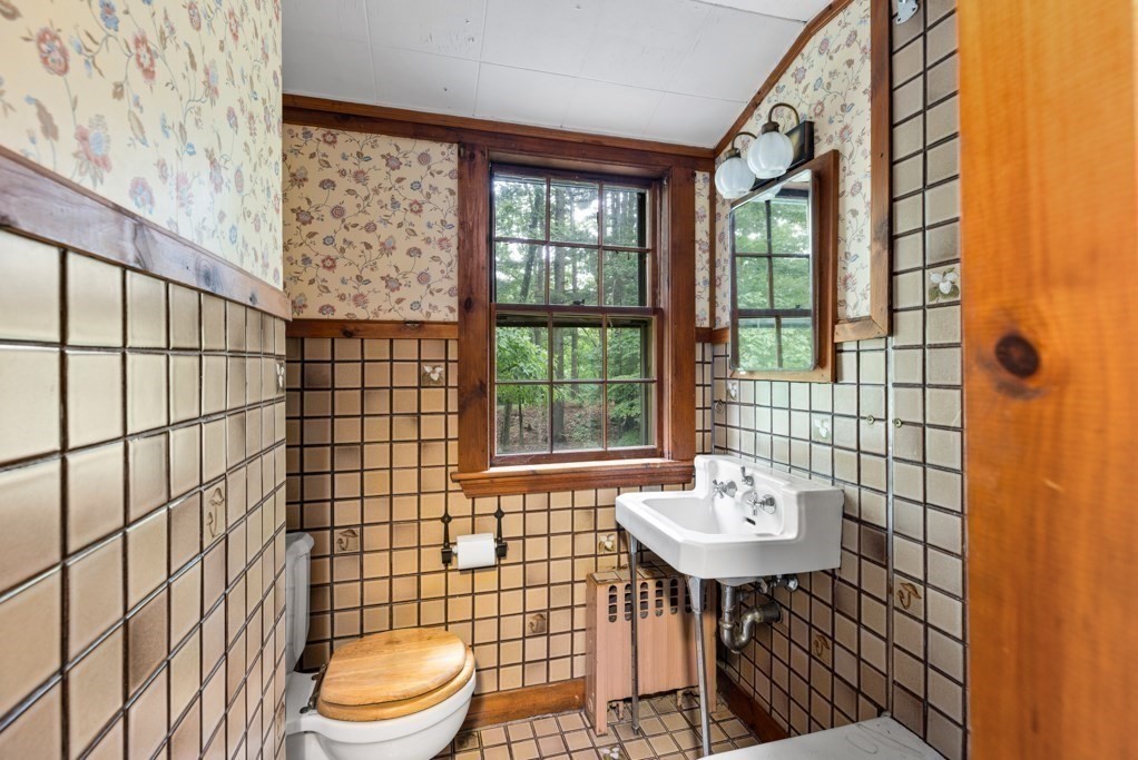 19 Forest Road Wakefield, MA 01880 - Photo 24 of 30 a bathroom with a sink toilet and shower