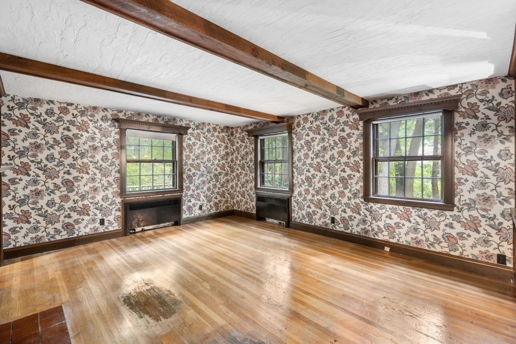 19 Forest Road Wakefield, MA 01880 - Photo 6 of 30 a view of an empty room with a window and wooden floor