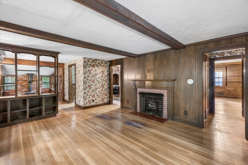 19 Forest Road Wakefield, MA 01880 - Photo 8 of 30 wooden floor fireplace and windows in an empty room