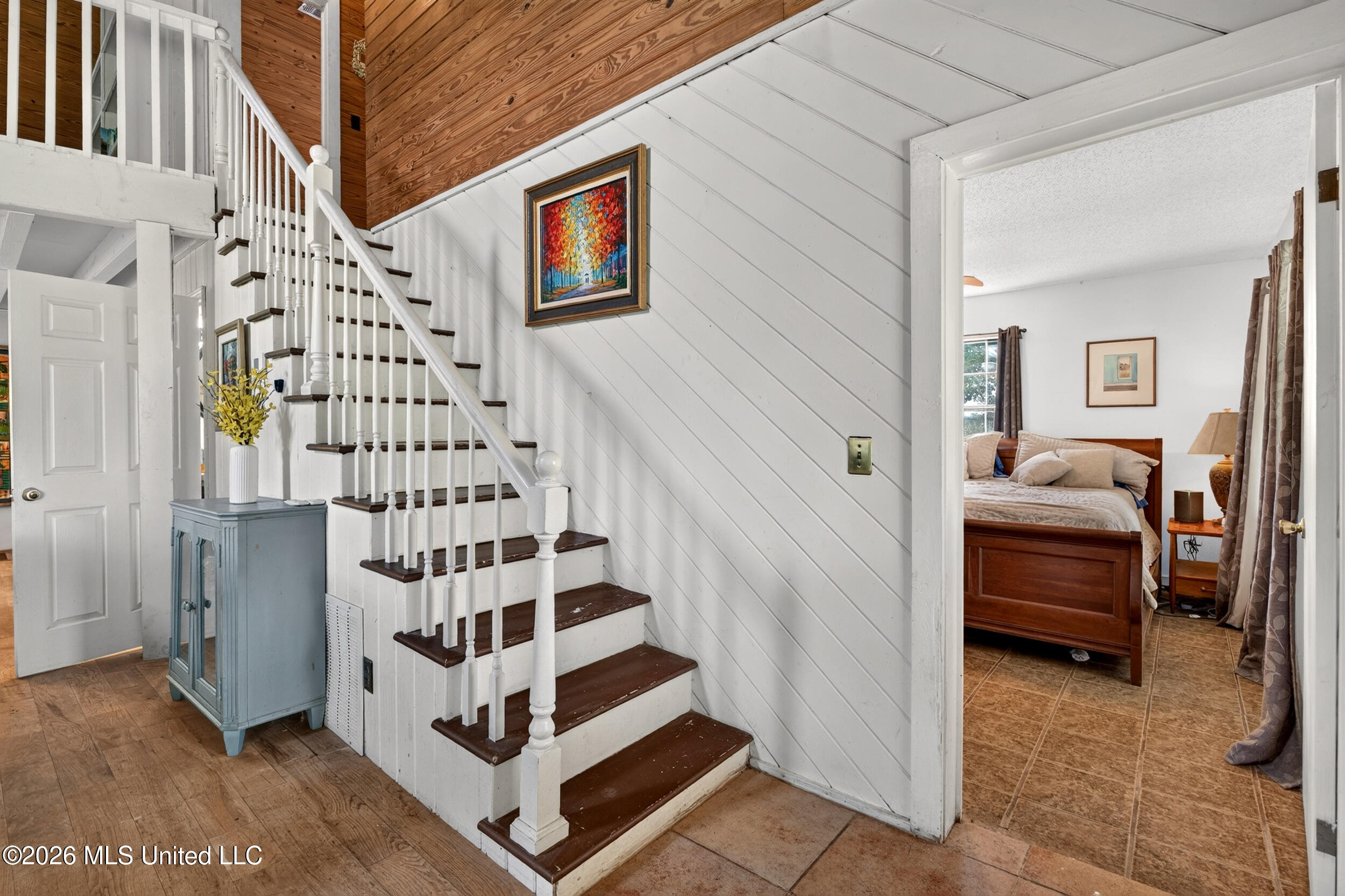 574 Slade Woodward Road Poplarville, MS 39470 - Photo 31 of 106 31_stairs_primarybedroom