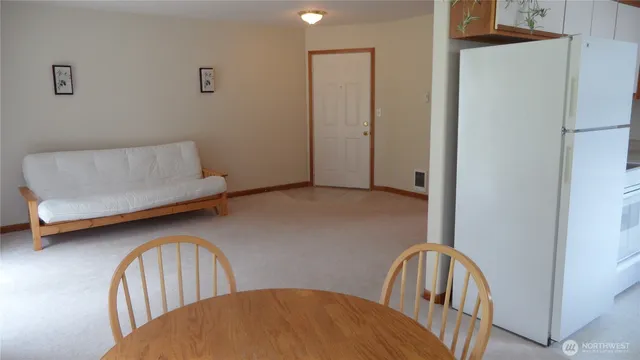 a bedroom with two beds and a dresser