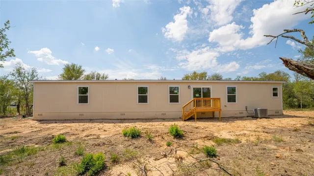 a view of a house with backyard