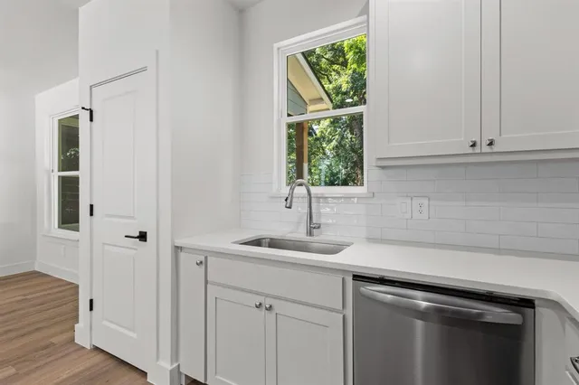 a kitchen with a sink and cabinets