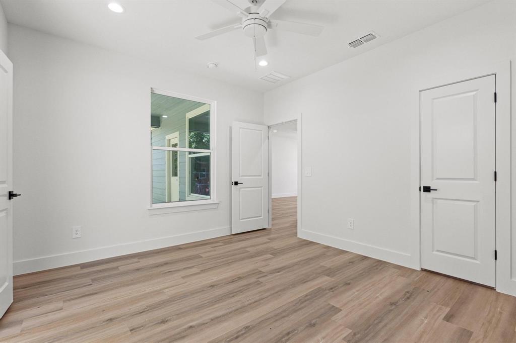 516 Florence Denison, TX 75020 - Photo 16 of 27 a view of an empty room with wooden floor and a window