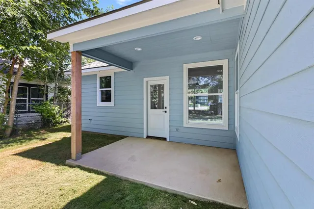 a view of a backyard of the house