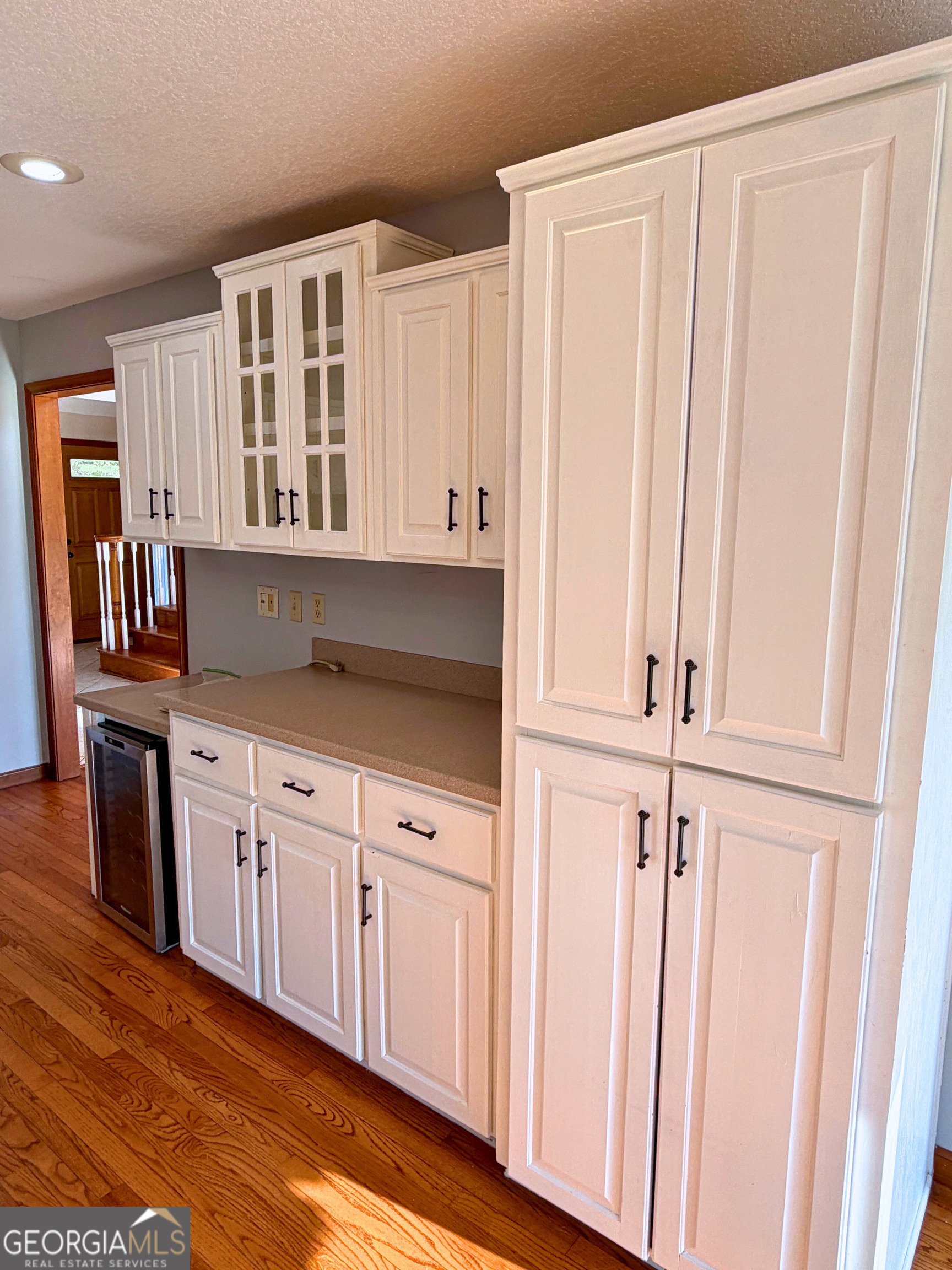 1818 Union Carbide Road Woodbine, GA 31569 - Photo 12 of 33 a kitchen with granite countertop white cabinets and sink
