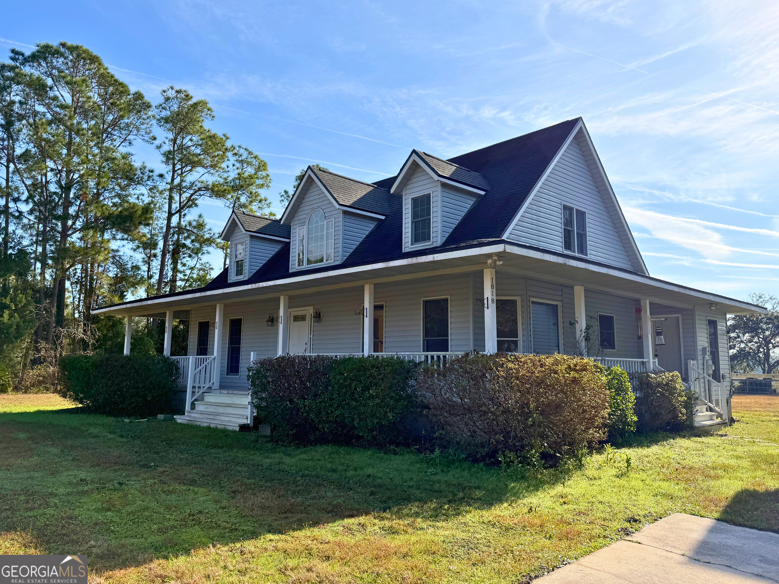 1818 Union Carbide Road Woodbine, GA 31569 - Photo 2 of 33 a front view of a house with garden