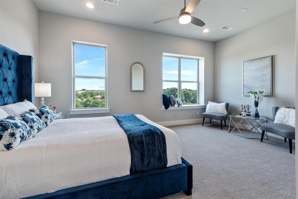 770 North Plano Road, Unit 303 Richardson, TX 75081 - Photo 11 of 25 This room features two large windows, providing ample natural light and views of the surrounding trees and residential properties