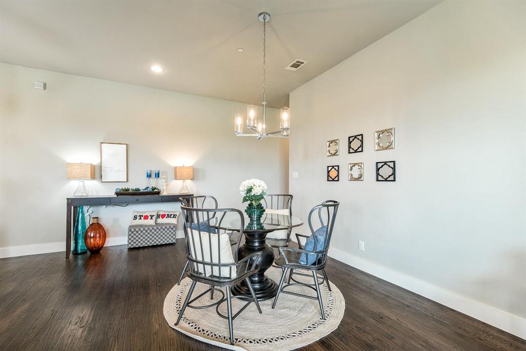 770 North Plano Road, Unit 303 Richardson, TX 75081 - Photo 3 of 25 The property features hardwood floors, a modern chandelier, and recessed lighting