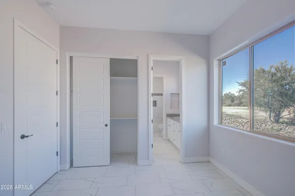 a bathroom with a toilet and a bathtub