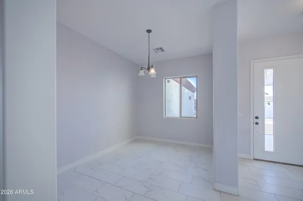 a view of a bathroom with a shower and a sink