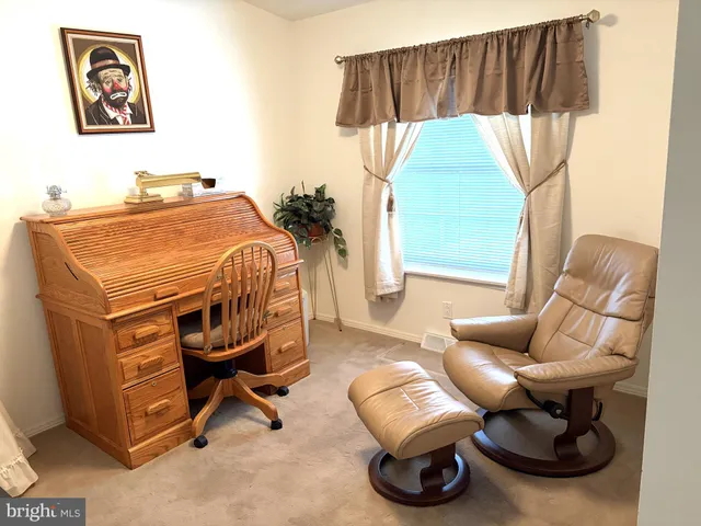 a bedroom with furniture and a wooden floor