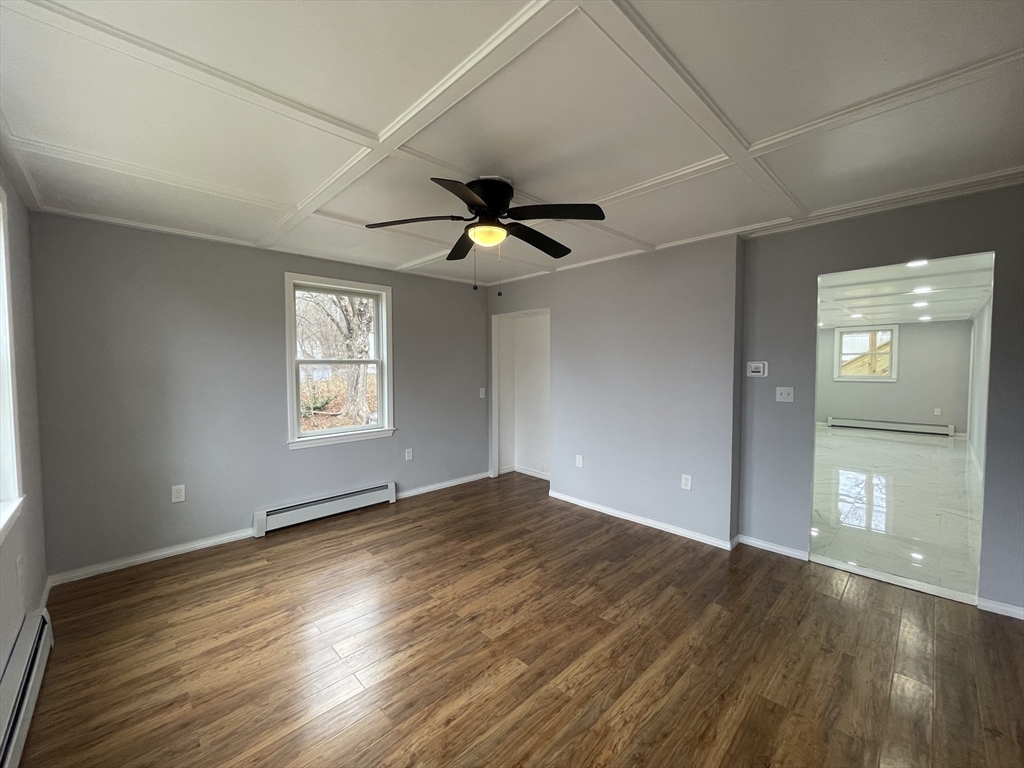 59 High Street Warren, MA 01083 - Photo 5 of 42 wooden floor in an empty room with a window