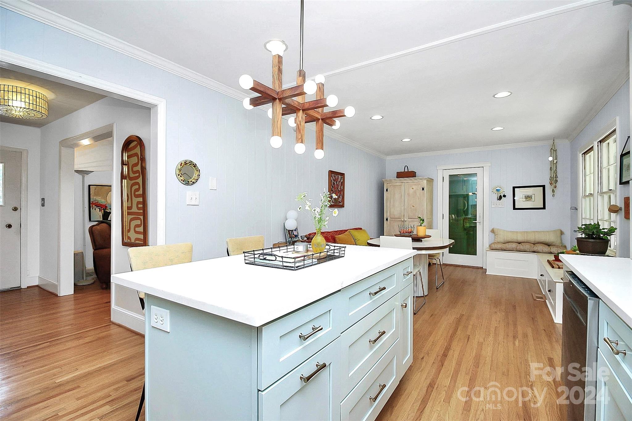 1011 Nancy Drive Charlotte, NC 28211 - Photo 18 of 44 a view of a kitchen counter space a sink wooden floor and a chandelier