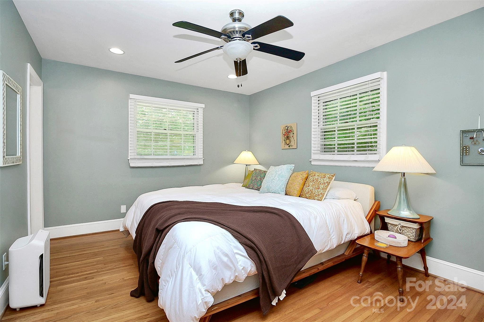 1011 Nancy Drive Charlotte, NC 28211 - Photo 37 of 44 a bedroom with a bed and a chandelier