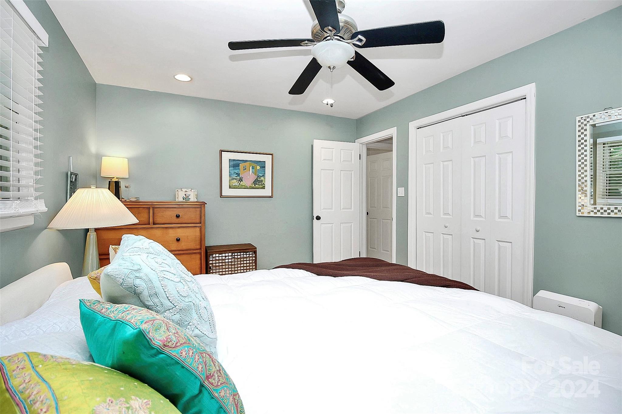 1011 Nancy Drive Charlotte, NC 28211 - Photo 39 of 44 a bedroom with a bed and a chandelier
