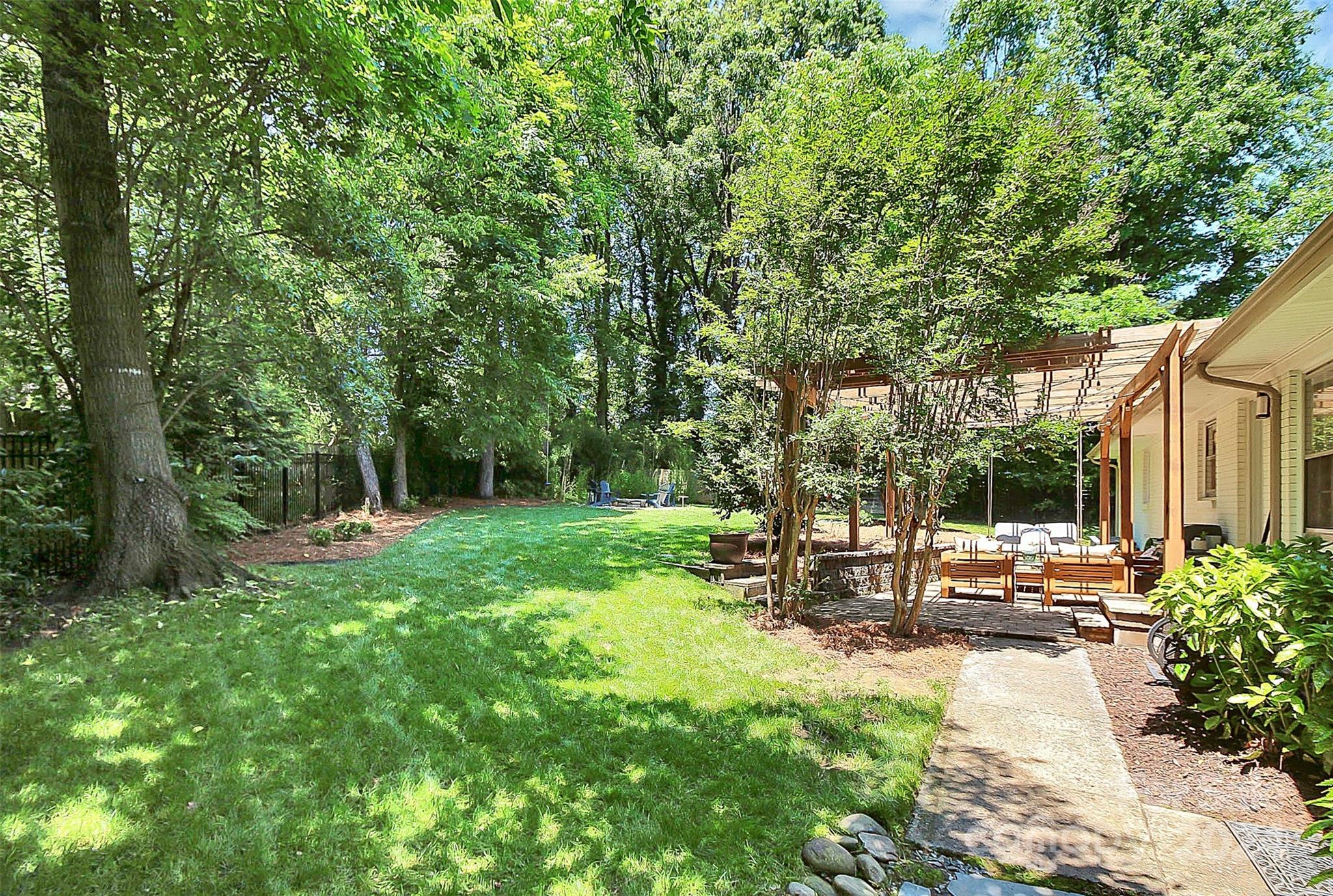 1011 Nancy Drive Charlotte, NC 28211 - Photo 5 of 44 a view of a park with large trees