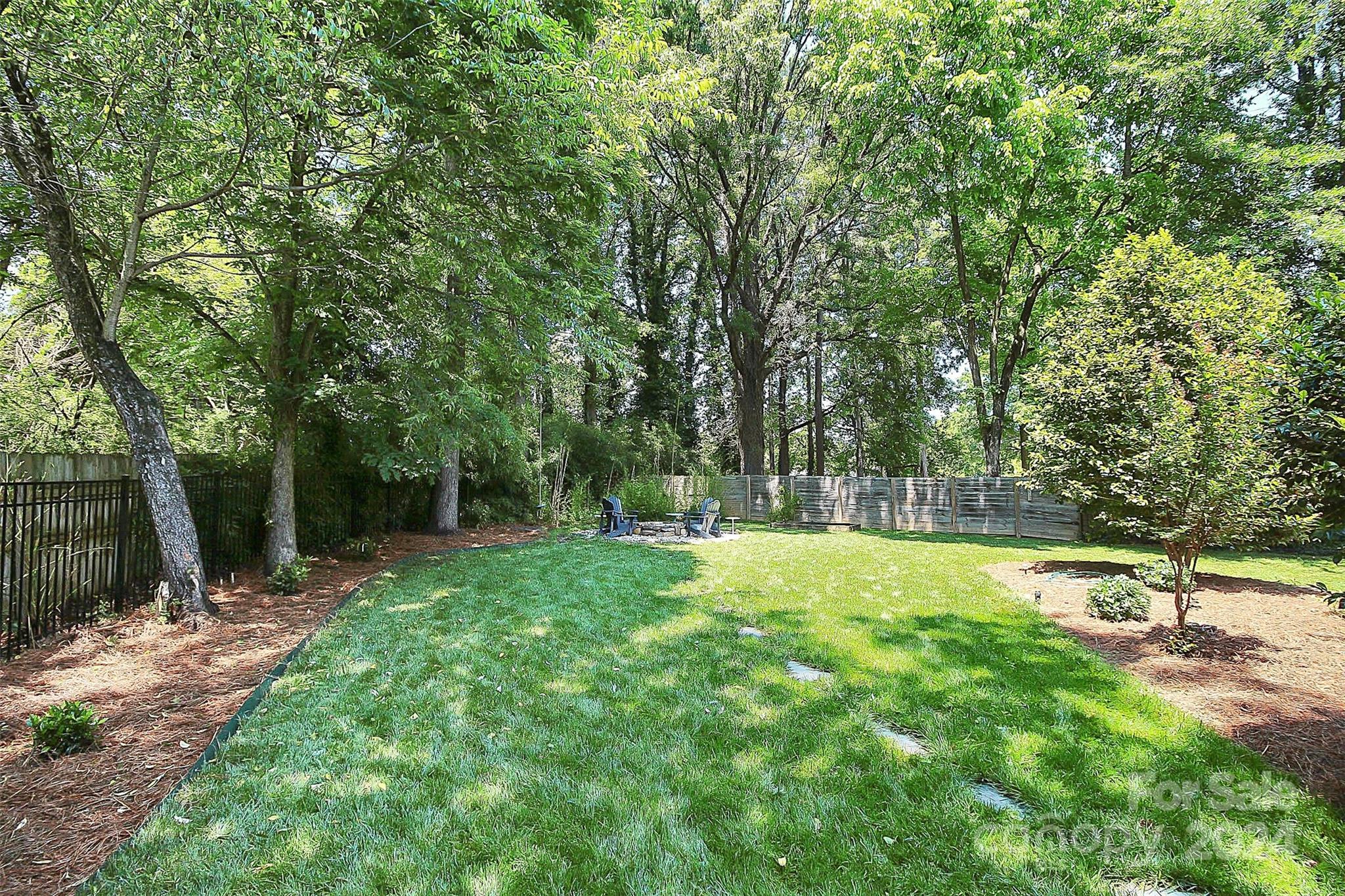1011 Nancy Drive Charlotte, NC 28211 - Photo 9 of 44 a backyard of a house with lots of green space