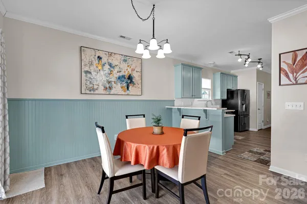 a dining room with furniture and window