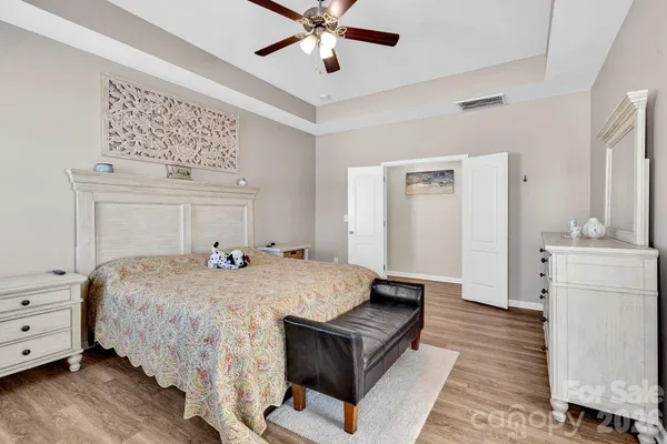 a bed room with a bed and dresser