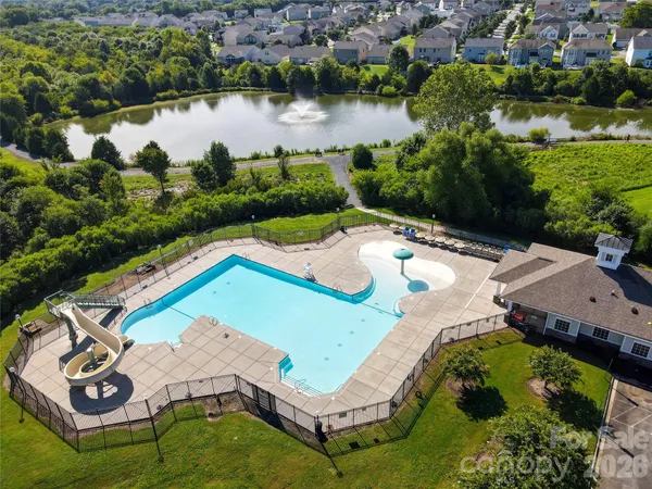 an aerial view of a house having outdoor space swimming pool and outdoor seating