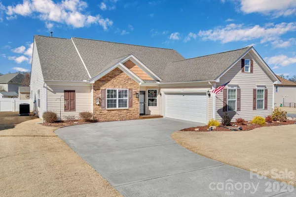 a front view of a house with a garage