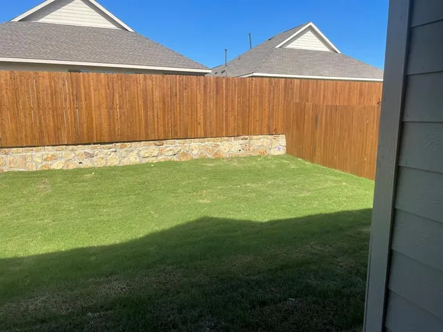 a view of a backyard with a small cabin