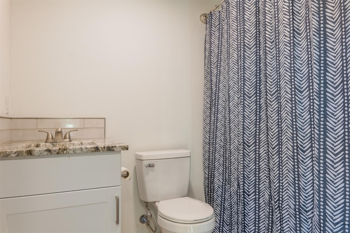 420 Bonell Drive Fairplay, CO 80440 - Photo 12 of 35 a bathroom with a granite countertop toilet and a sink