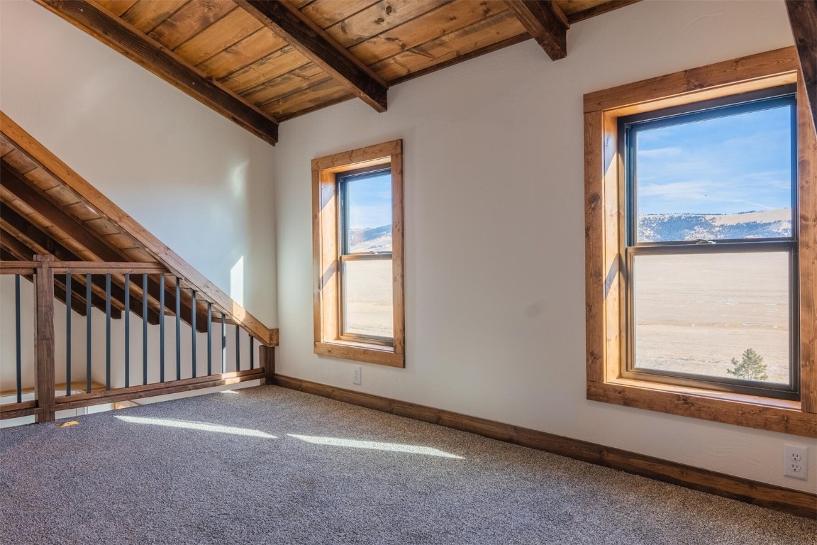 420 Bonell Drive Fairplay, CO 80440 - Photo 17 of 35 a view of an empty room with wooden floor and a window