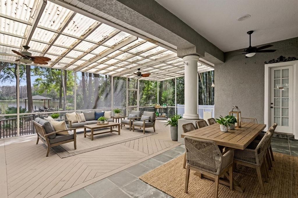 3632 Little Road Lutz, FL 33548 - Photo 11 of 44 a living room with patio furniture and a potted plant