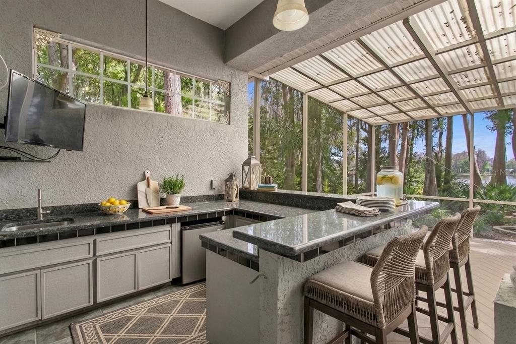 3632 Little Road Lutz, FL 33548 - Photo 13 of 44 a kitchen that has a sink and a stove in it