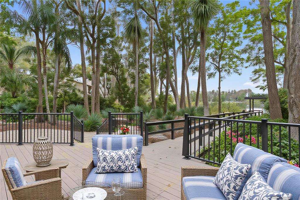 3632 Little Road Lutz, FL 33548 - Photo 14 of 44 a view of a patio with couches chairs and wooden floor
