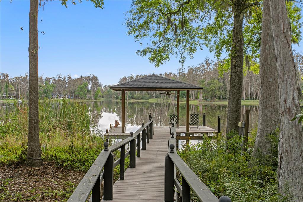 3632 Little Road Lutz, FL 33548 - Photo 16 of 44 a view of a balcony with chairs and floor to ceiling window