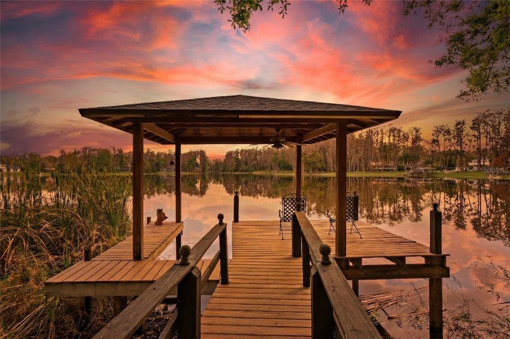 3632 Little Road Lutz, FL 33548 - Photo 17 of 44 a view of a balcony with chairs and wooden floor