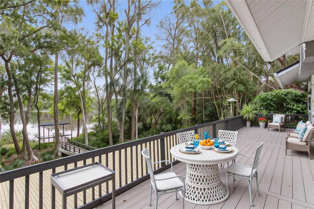 3632 Little Road Lutz, FL 33548 - Photo 27 of 44 a view of a table and chairs in the balcony
