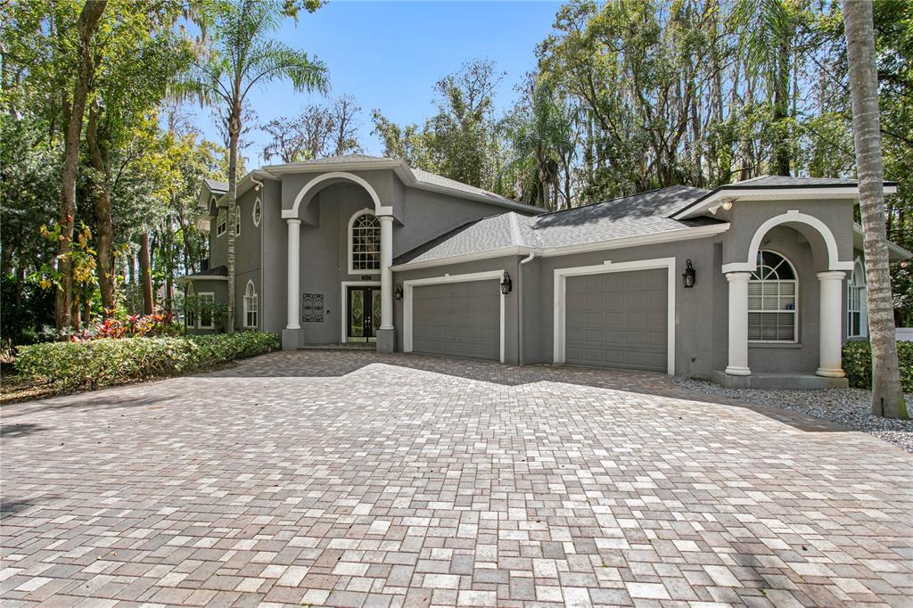 3632 Little Road Lutz, FL 33548 - Photo 35 of 44 a front view of a house with a yard