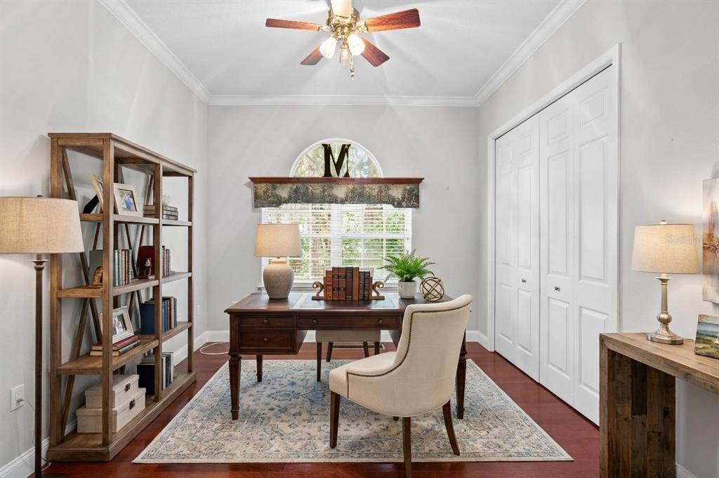 3632 Little Road Lutz, FL 33548 - Photo 4 of 44 a dining room with furniture and a book shelf