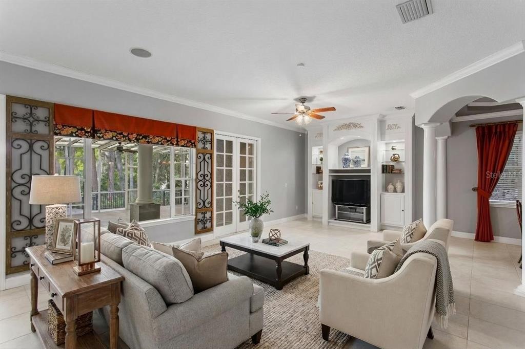 3632 Little Road Lutz, FL 33548 - Photo 10 of 44 a living room with furniture and a large window