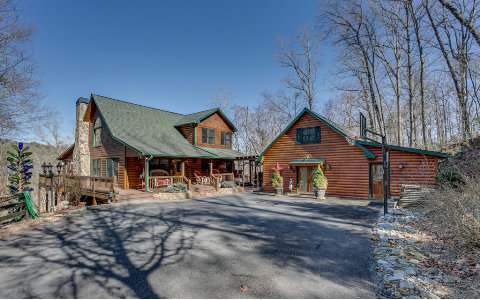 235 Stillwater Road Blue Ridge, GA 30513 - Photo 1 of 1 a front view of a house with large trees