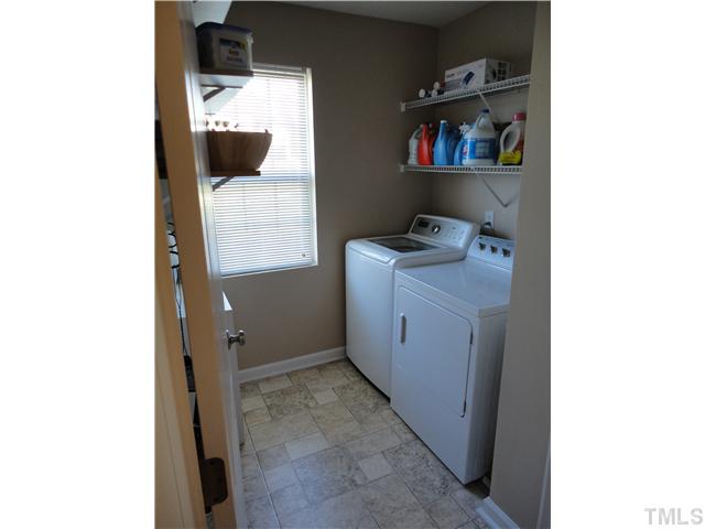 4812 Cardinal Grove Boulevard Raleigh, NC 27616 - Photo 11 of 19 Spacious laundry room plenty large to hold ironing board and baskets