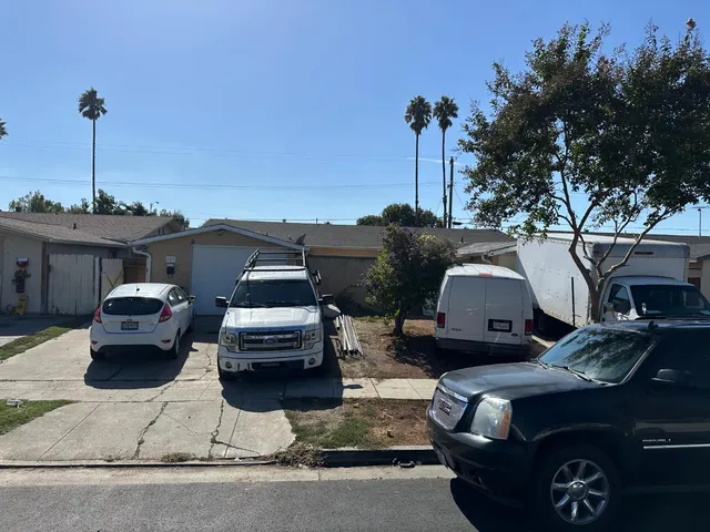 a front view of a house with parking space