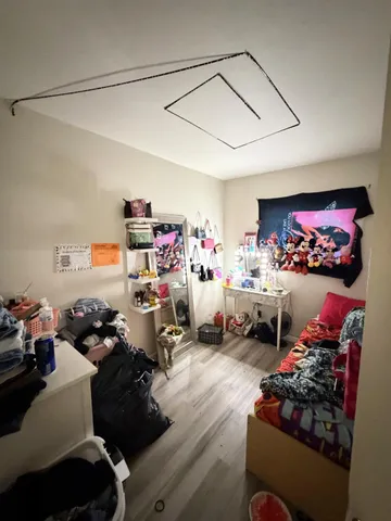 a front view of a house with chair and tables