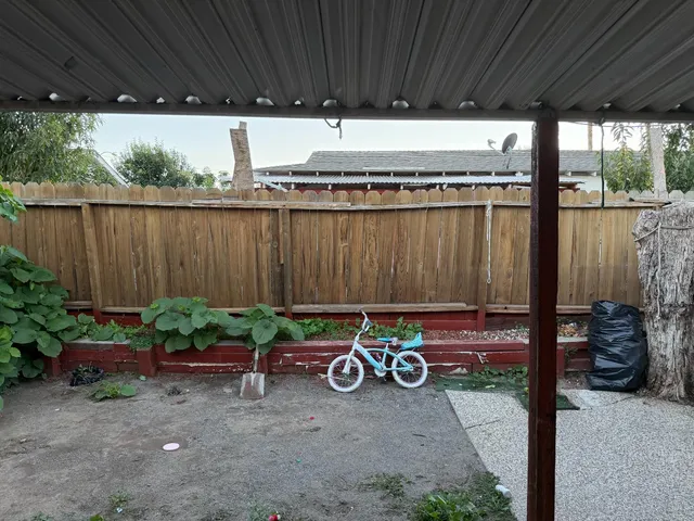 a view of a backyard of the house