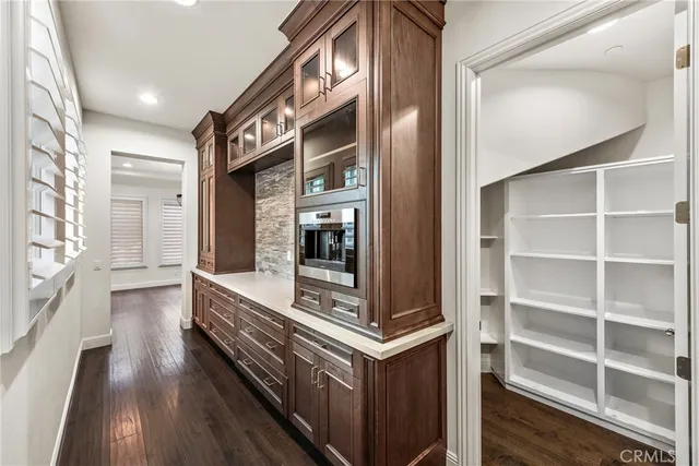 a view of living room and wooden floor