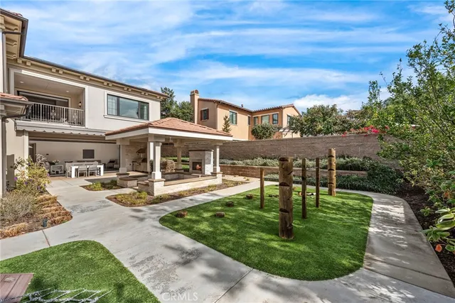 a swimming pool with outdoor seating yard and barbeque oven