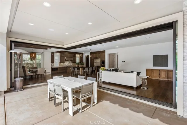 a living room with a table and chairs