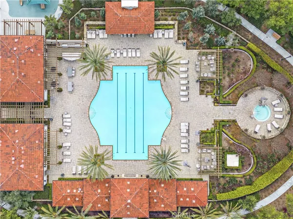 an aerial view of a house with a swimming pool