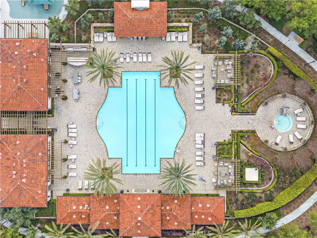 an aerial view of a house with a swimming pool