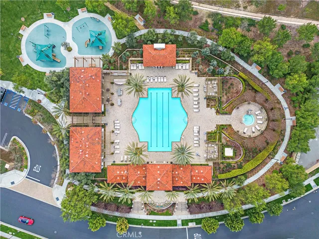 an aerial view of a wooden play ground and swimming pool
